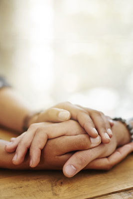 a close-up of hands on a table